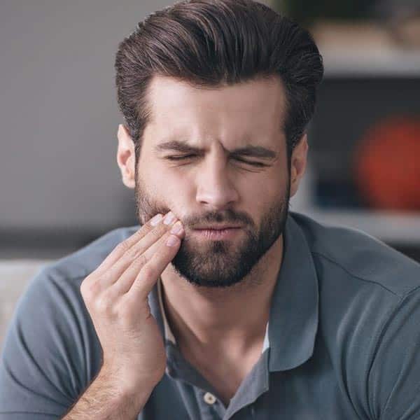 man with jaw pain